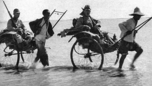 Japanese soldiers in rickshaws.jpg