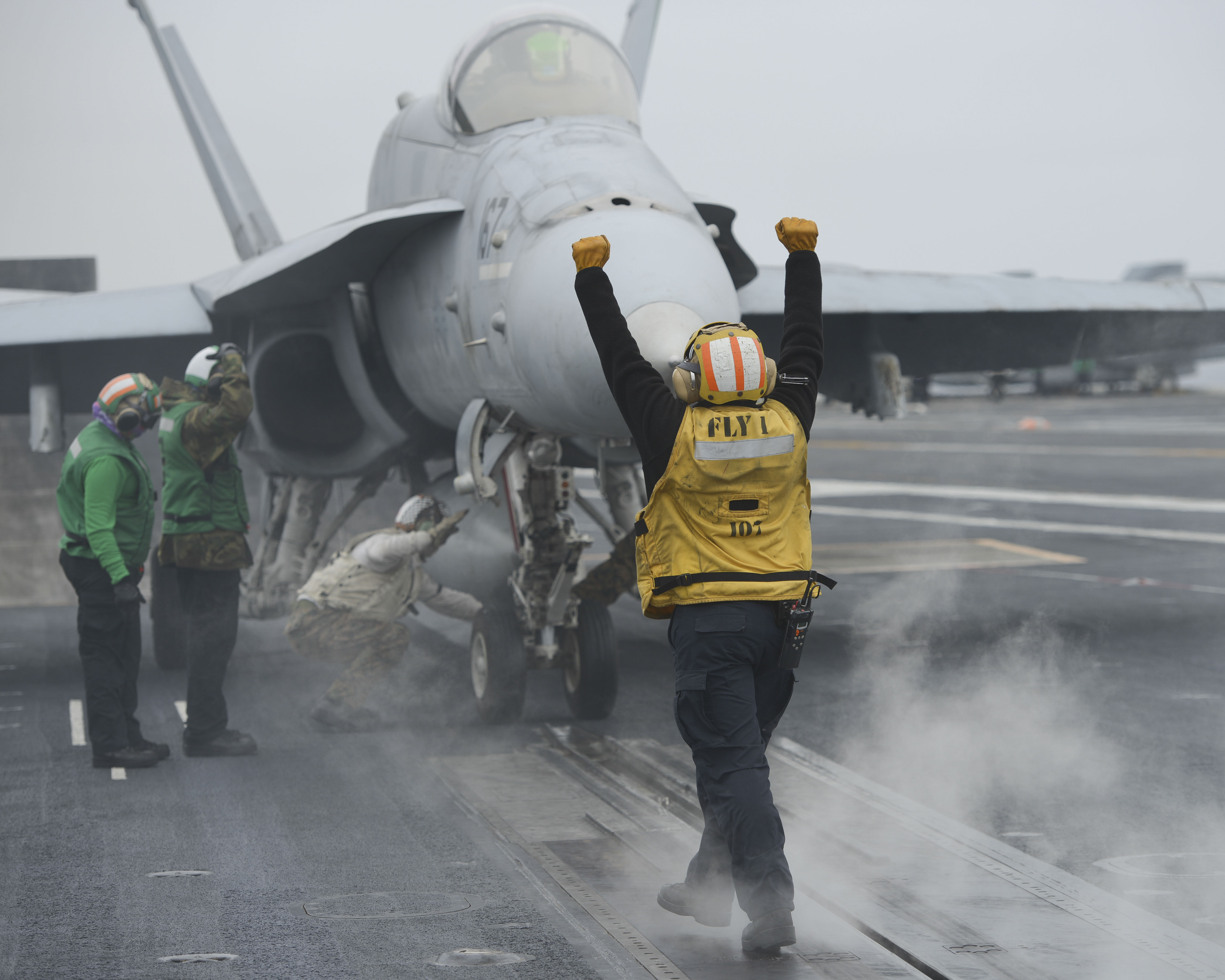 deck crew launching aircraft.jpg