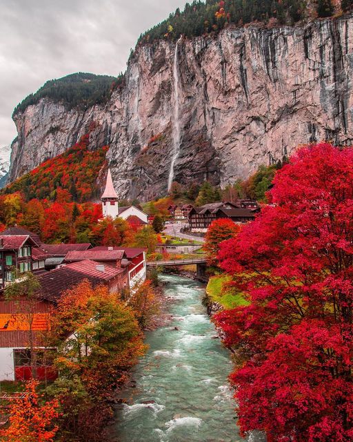 autumn view of Lauterbrunnen village with awesome waterfall Staubbach and Swiss Alps.jpg
