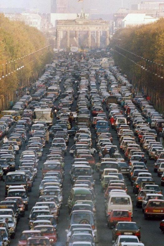 TRAFFIC JAM AS EAST GERMANS DRIVE TO WEST BERLIN AFTER THE FALL OF THE BERLIN WALL, 1989.jpg