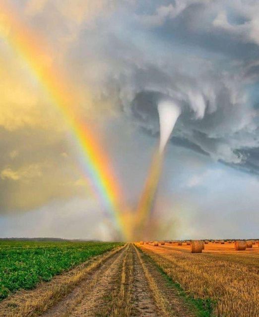 a funnel cloud sucking up a rainbow.jpg