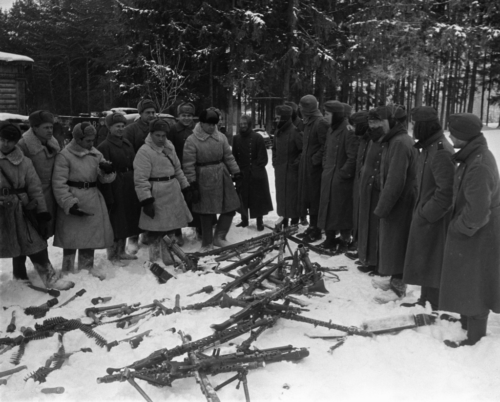 Soviet officers inspecting captured German troops and weapons, near Moscow, Russia, 20 Dec 1941.jpg