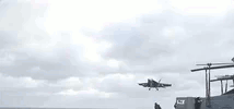 plane landing on carrier.gif