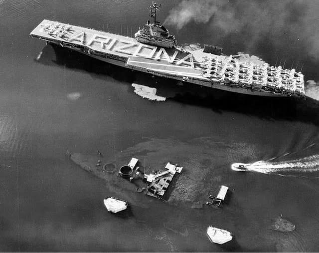 USS Bennington sailing by the wreck of USS Arizona.jpg